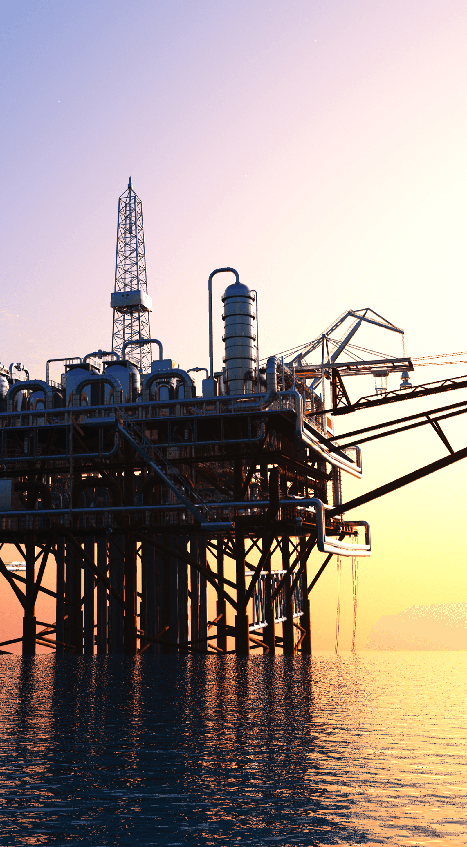 Offshore oil platform with sunset in the background.